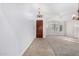 Spacious, light-filled living room with plush carpeting and elegant chandelier at 1321 N Bronco Ct, Gilbert, AZ 85233