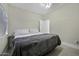 Comfortable bedroom with tile floors and neutral-toned walls at 1409 E Apollo Rd, Phoenix, AZ 85042