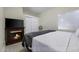Cozy bedroom featuring a fireplace, closet with sliding doors, and comfortable bed at 1409 E Apollo Rd, Phoenix, AZ 85042