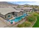 Aerial view of a backyard with a pool, outdoor seating, and mature landscaping at 1432 E Pedro Rd, Phoenix, AZ 85042