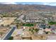 A stunning aerial perspective shows a well-planned community against a mountain backdrop, revealing lush landscaping at 1432 E Pedro Rd, Phoenix, AZ 85042