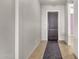 Bright entryway featuring a wooden front door and tile flooring at 1432 E Pedro Rd, Phoenix, AZ 85042