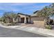 A charming single-Gathering home with a two-car garage, desert landscaping, and a covered entryway at 1432 E Pedro Rd, Phoenix, AZ 85042