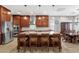 Spacious kitchen with a large center island, stainless steel appliances, and wooden cabinetry at 1432 E Pedro Rd, Phoenix, AZ 85042