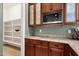 Kitchen corner with granite countertops, built-in microwave, and ample storage at 1432 E Pedro Rd, Phoenix, AZ 85042