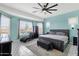 Well-lit main bedroom featuring patterned floors, large windows and shades, and stylish furniture at 1432 E Pedro Rd, Phoenix, AZ 85042