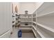 Walk-in pantry with ample shelving providing plenty of space for storage at 1432 E Pedro Rd, Phoenix, AZ 85042