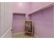 A smaller walk-in closet features ample vertical storage space and a chalkboard at 1432 E Pedro Rd, Phoenix, AZ 85042