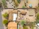 Expansive property with a large backyard featuring desert landscaping, additional buildings, and fire pits at 14418 N San Carlos Dr, Fountain Hills, AZ 85268