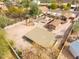 Aerial view of a desert home with a spacious yard, including a detached structure, desert landscaping, and privacy walls at 14418 N San Carlos Dr, Fountain Hills, AZ 85268