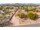Charming desert home featuring rock landscaping, mature trees, an extended driveway and mountain views at 14418 N San Carlos Dr, Fountain Hills, AZ 85268