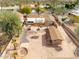 Backyard featuring a large stone patio, fire pit, and additional workshop building, perfect for outdoor living at 14418 N San Carlos Dr, Fountain Hills, AZ 85268