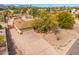 Charming desert home with mature trees and rock landscaping featuring an extended driveway and 2-car garage at 14418 N San Carlos Dr, Fountain Hills, AZ 85268
