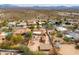 Home featuring desert landscaping, a private backyard with fire pits and additional buildings in a residential area at 14418 N San Carlos Dr, Fountain Hills, AZ 85268
