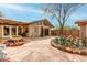 Landscaped backyard with flagstone patio with desert plants, rocks, cacti, and trees at 14418 N San Carlos Dr, Fountain Hills, AZ 85268