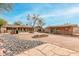 Sprawling landscaped backyard featuring flagstone patio and desert landscaping at 14418 N San Carlos Dr, Fountain Hills, AZ 85268
