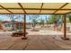 An inviting backyard featuring stone flooring, a covered patio, and a built in outdoor grill at 14418 N San Carlos Dr, Fountain Hills, AZ 85268