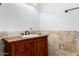 Bathroom with a wooden vanity, tiled backsplash, and a mirror at 14418 N San Carlos Dr, Fountain Hills, AZ 85268