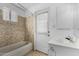 Bathroom featuring a tub, hexagon tile and a window for natural light at 14418 N San Carlos Dr, Fountain Hills, AZ 85268