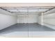 A garage with epoxy flooring, shelving, and ample storage space at 14418 N San Carlos Dr, Fountain Hills, AZ 85268