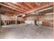A spacious garage featuring brick floors and open wooden ceiling with ample storage shelves at 14418 N San Carlos Dr, Fountain Hills, AZ 85268