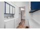 Bright laundry room with washer, dryer, and ample cabinet storage at 14418 N San Carlos Dr, Fountain Hills, AZ 85268
