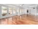 Bright living area with hardwood floors, multiple windows, and access to a patio at 14418 N San Carlos Dr, Fountain Hills, AZ 85268