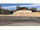 View of the neighborhood with block wall and mature trees at 1495 N Casa Grande Ave, Casa Grande, AZ 85122