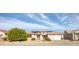 Charming single-story home featuring a red tile roof, desert landscaping, and a two-car garage at 15864 W Clearwater Way, Surprise, AZ 85374