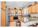 Well-appointed kitchen boasting stainless steel appliances, granite counters, and ample cabinet space at 16875 W Manchester Dr, Surprise, AZ 85374