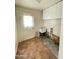 Laundry room featuring a utility sink, white cabinets and a white door at 1819 W Morten Ave, Phoenix, AZ 85021