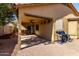 Cozy back patio with a BBQ, seating area and shade at 19863 N Emmerson Dr, Maricopa, AZ 85138