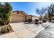 Charming home featuring a well-kept lawn, desert landscaping and an attached garage at 19863 N Emmerson Dr, Maricopa, AZ 85138