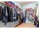 The walk-in closet provides ample storage space for clothes and accessories at 19863 N Emmerson Dr, Maricopa, AZ 85138