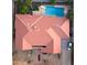 An aerial view of the home featuring a red tile roof, a backyard pool, mature trees and well-maintained landscaping at 2107 E Inca St, Mesa, AZ 85213