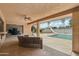 Spacious covered back patio with view of the pool and slide at 2107 E Inca St, Mesa, AZ 85213