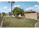 Backyard featuring large grass area, mature trees, a seating area, and pool at 2107 E Inca St, Mesa, AZ 85213
