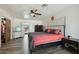 Comfortable main bedroom featuring a ceiling fan and a view to another sitting area at 2107 E Inca St, Mesa, AZ 85213