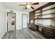 Bedroom features dark wood built in cabinet and shelves and neutral gray flooring at 2107 E Inca St, Mesa, AZ 85213