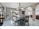 Dining room featuring decorative arches and a large table with a bench at 2107 E Inca St, Mesa, AZ 85213