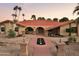 Inviting front yard featuring desert landscaping, a red walkway and a welcoming entrance with arched openings at 2107 E Inca St, Mesa, AZ 85213