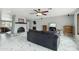 Spacious living room featuring a cozy fireplace, ceiling fan, and open floor plan at 2107 E Inca St, Mesa, AZ 85213