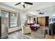 Another view of the bright and airy living room with plank floors and lots of natural light at 2107 E Inca St, Mesa, AZ 85213