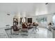 Stylish living room with marble flooring, a seating area, and arched doorways leading to other spaces at 2107 E Inca St, Mesa, AZ 85213