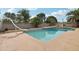 Backyard pool featuring a diving board, a slide, and mature landscaping at 2107 E Inca St, Mesa, AZ 85213