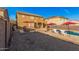 Spacious backyard with a pool, seating area, and barbecue station, perfect for outdoor entertaining and summer fun at 22157 W Moonlight Path, Buckeye, AZ 85326