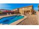Enjoy a refreshing dip in this backyard pool, surrounded by a patio, ideal for outdoor relaxation and entertaining at 22157 W Moonlight Path, Buckeye, AZ 85326