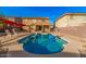 Beautiful backyard pool with ample space, perfect for relaxation and fun in the sun with patio furniture at 22157 W Moonlight Path, Buckeye, AZ 85326