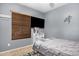 Bedroom featuring a large window with blinds, a TV, and a comfortable bed at 22157 W Moonlight Path, Buckeye, AZ 85326
