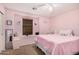 Bright bedroom with a window seat, ceiling fan, and a full-sized bed at 22157 W Moonlight Path, Buckeye, AZ 85326